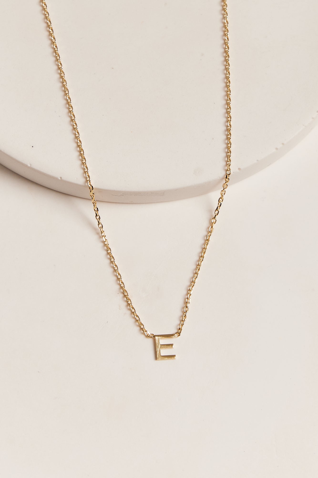 Letter e necklace deals gold